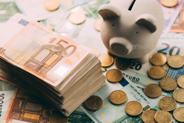 Piggy moneybox with euro cash - Stock Photo - Images