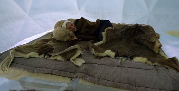 Girl Sleeping in an Incredible Ice Bed inside an Igloo alt