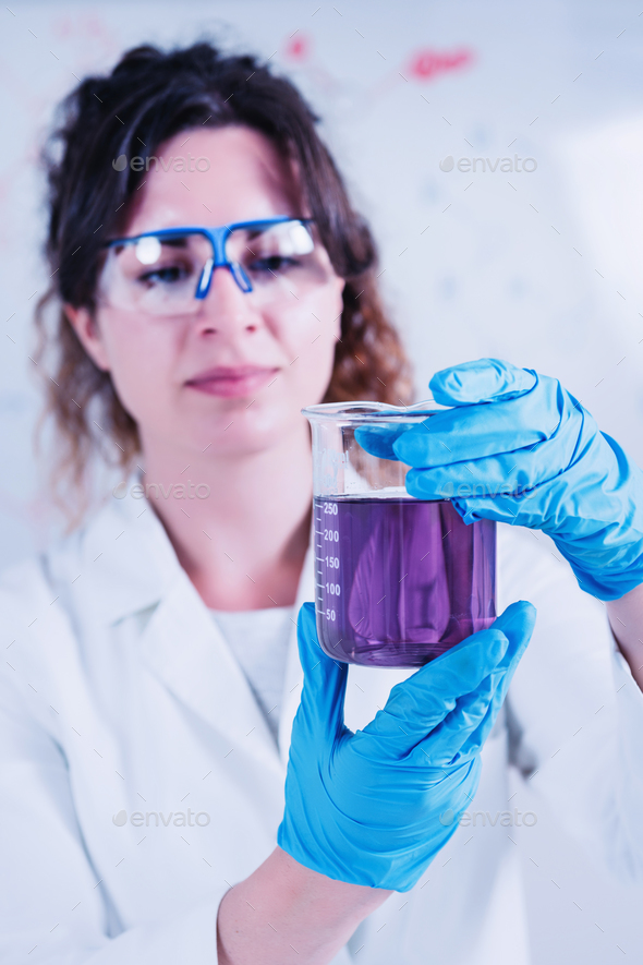 Young Female Scientist Doing Experiments In The Laboratory - Stock Photo - Images