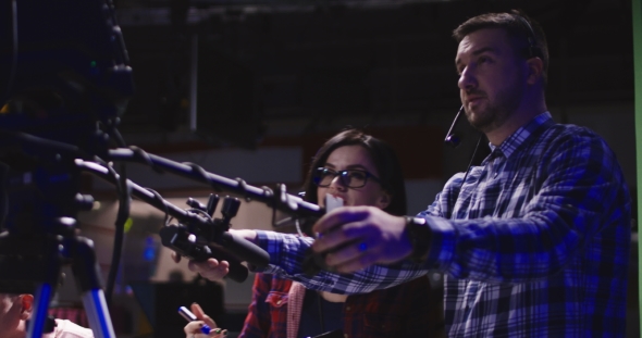 Cameraman in Process of Work in Studio alt