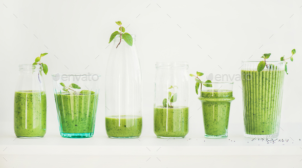 Matcha green smoothie with chia seeds in glasses and bottles - Stock Photo - Images