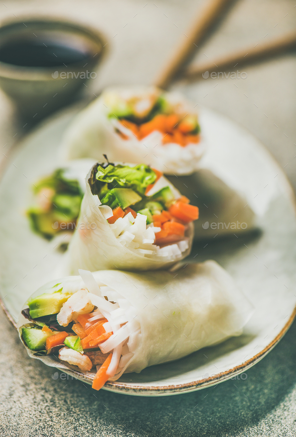 Shrimp and vegetable rice paper rolls on ceramic plate - Stock Photo - Images
