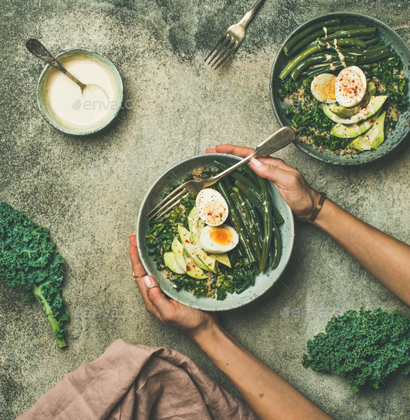 Quinoa, kale, beans, avocado, egg bowls, top view - Stock Photo - Images