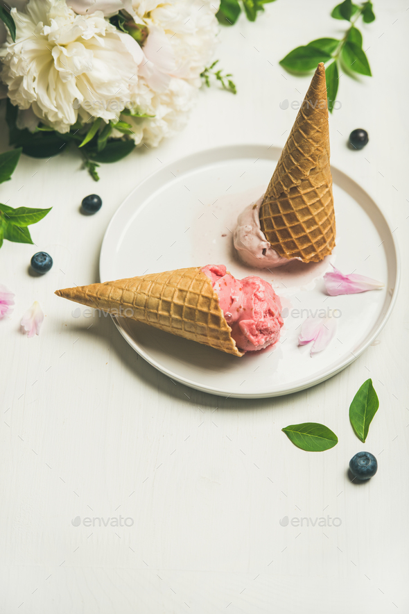 Ice cream scoops and peonies over white background, copy space - Stock Photo - Images