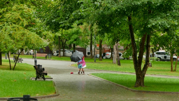 A Girl Is Circling a Boy in the Rain