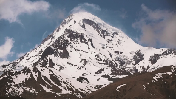 Kazbegi, Georgia Peak Of Mount Kazbek Covered With Snow. Kazbek Is A Stratovolcano And One Of Major alt