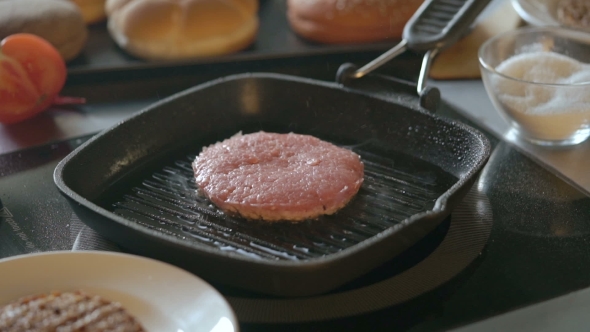 Fresh Meat Cutlet in a Frying Pan Grill