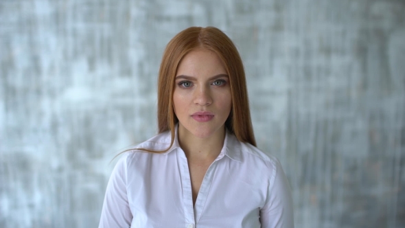 Portrait of a Young Beautiful Woman. Frightened Gesture. .  Portrait of Young Caucasian Woman Bein