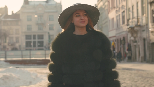 Young Girl Calling Somebody on the Phone, Talking and Smiling Happily alt