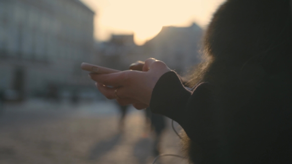 Woman Hands Using Touchscreen Phone Outdoors in City