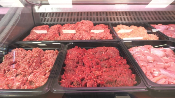 Showcase in the Store with Pork Meat, Beef, Poultry alt