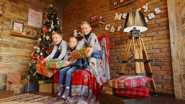 Three Little Brothers Rejoice at Christmas Gifts