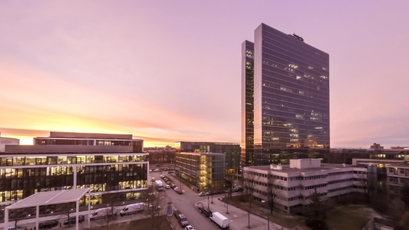 Aerial  of Business Skyscrapers Lights Going On and Off During Sunrise alt