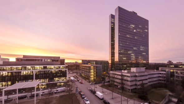 Aerial  of Business Skyscrapers Lights Going On and Off During Sunrise alt