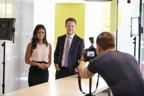 Three people making a corporate demonstration video Stock Photo by monkeybusiness