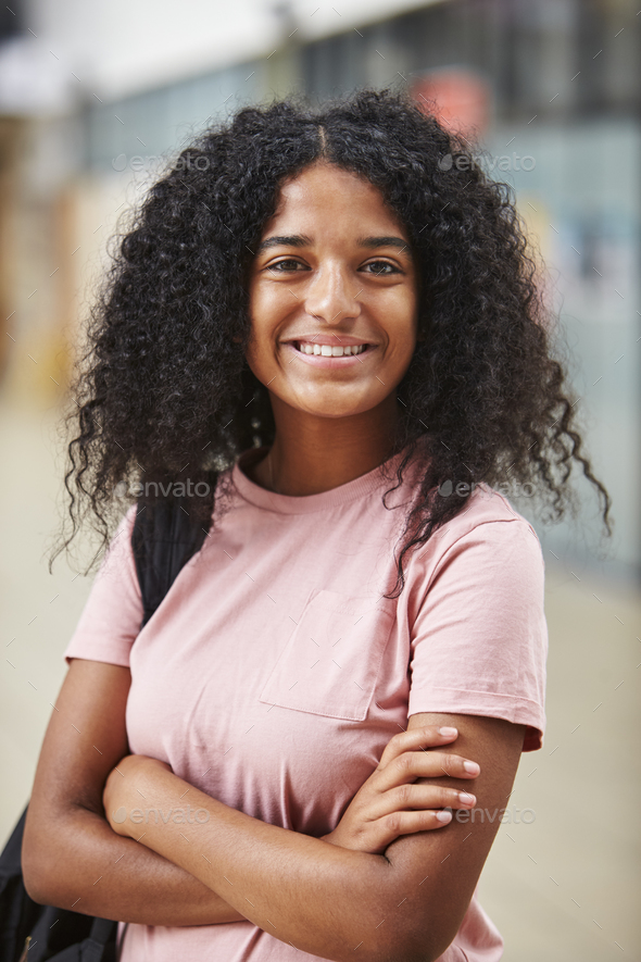 Portrait Of Female Student Standing In College Building - Stock Photo - Images