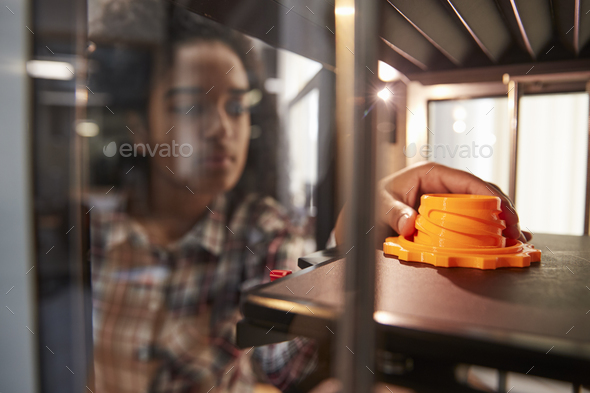 Female College Student Printing 3D Object In Design Lesson Stock Photo by monkeybusiness