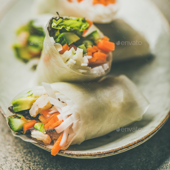 Shrimp and vegetable rice paper rolls on plate, square crop - Stock Photo - Images