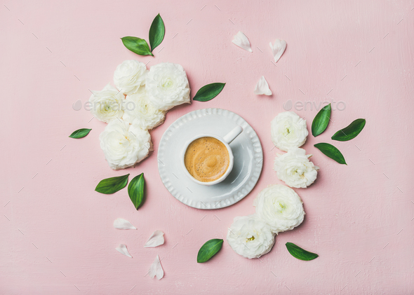 Cup of coffee surrounded with white ranunculus flowers - Stock Photo - Images