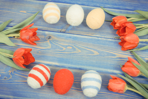 Vintage photo, Easter eggs and fresh red tulips on boards, festive decoration, copy space for text - Stock Photo - Images