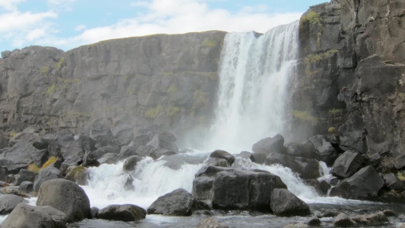 Oxararfoss Waterfall in a National Park Thingvellir in Iceland in Cloudy Day