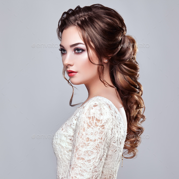Brunette woman with long and shiny curly hair - Stock Photo - Images