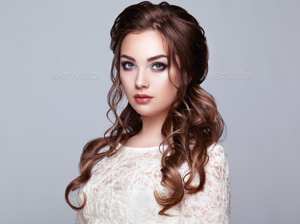 Brunette woman with long and shiny curly hair - Stock Photo - Images