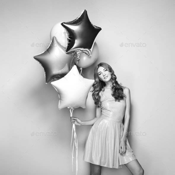 Beautiful young woman with balloons - Stock Photo - Images