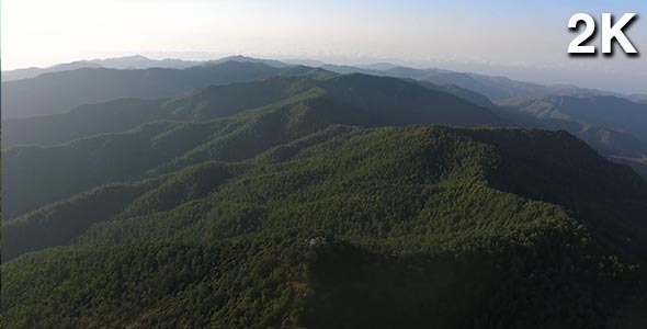 Flying Above The Mountains with Green Forest (moving forward) alt