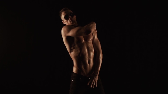 Sexy Man Dancing on Black Background