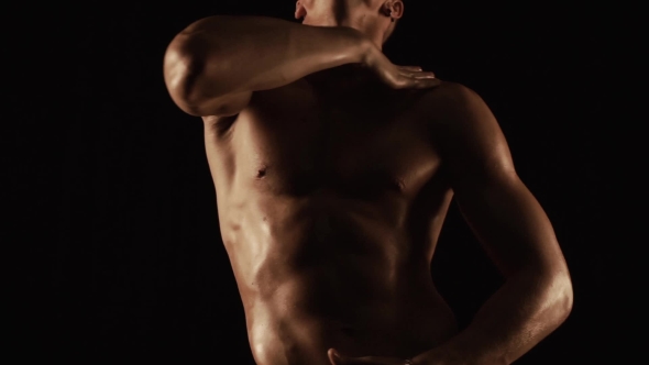 Sexy Man Dancing on Black Background alt