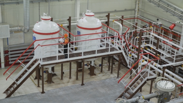 the Worker Inspects the Tank alt