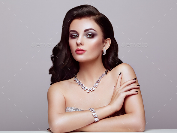 Brunette woman with long shiny wavy hair - Stock Photo - Images