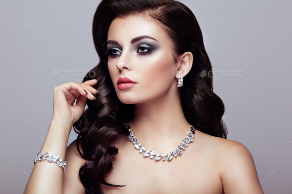 Brunette woman with long shiny wavy hair - Stock Photo - Images