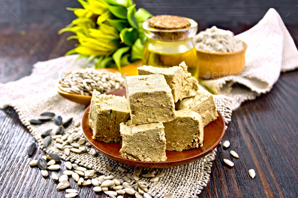Halva in plate on dark board - Stock Photo - Images
