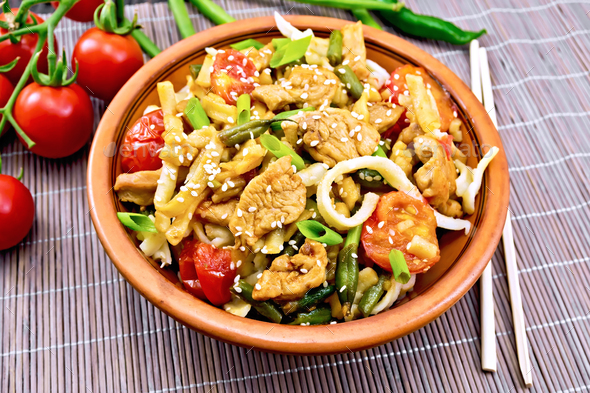Noodles wok Thai in plate on bamboo - Stock Photo - Images