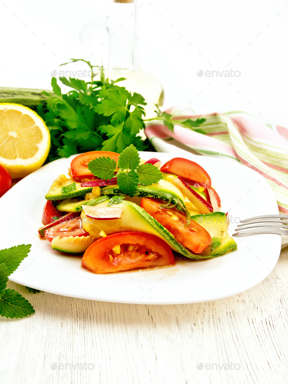 Salad with zucchini and tomato on board - Stock Photo - Images