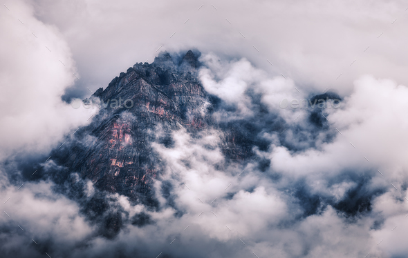 Mountains in clouds in overcast evening in Nepal - Stock Photo - Images