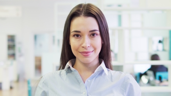 Face of a Happy Young Caucasian Brunette Woman in a Shirt