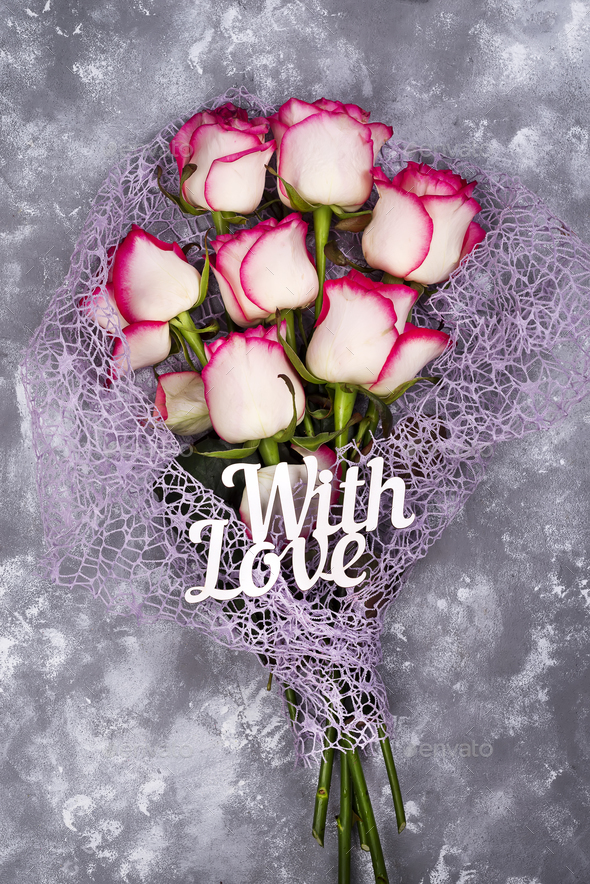 Red white rose flower bouquet and lettering With Love on stone table. - Stock Photo - Images