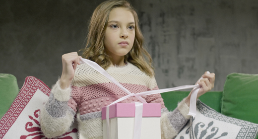 Teenager girl with family and gifts