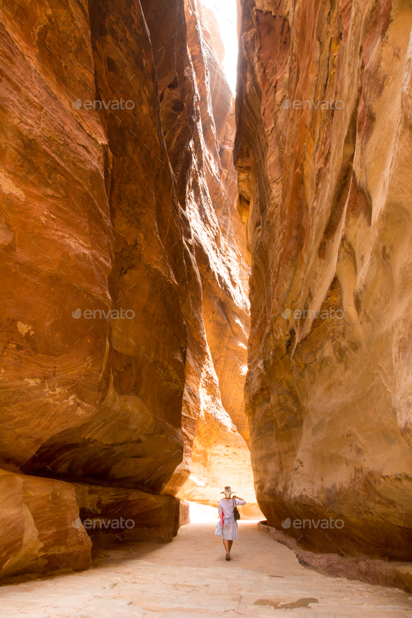 A lone tourist walking to the Treasury, Petra, Jordan - Stock Photo - Images