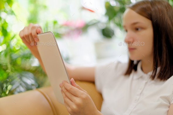 Girl holding tablet - Stock Photo - Images