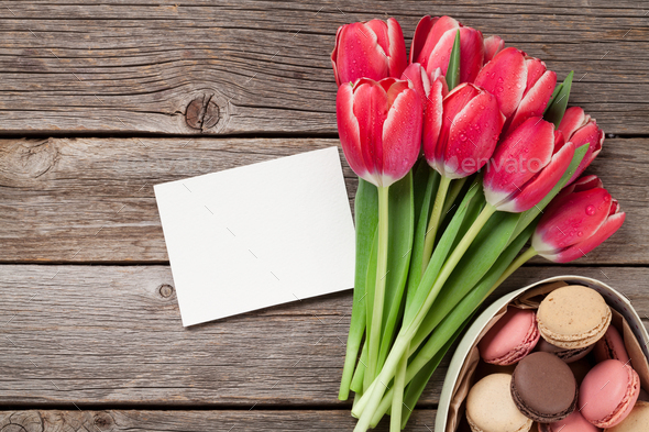 Red tulip flowers and macaroon cookies - Stock Photo - Images