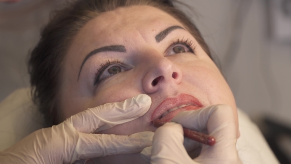 Professional Specialist of Permanent Make-up Applying Lips Before the Procedure. Beauty