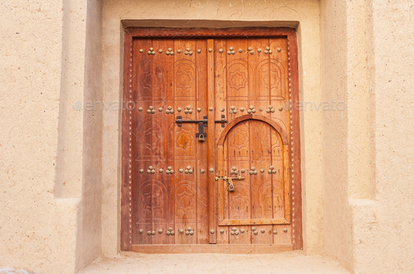 Traditional Arabian 'Door Within a Door' Stock Photo by zambezi | PhotoDune
