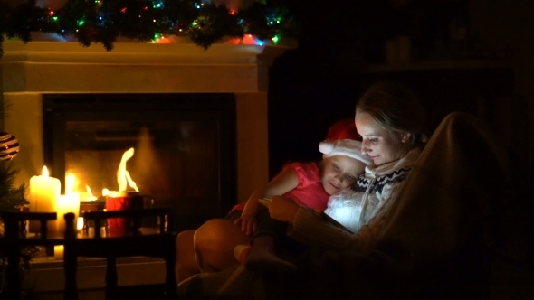 Mom and Daughter Spend the Evening Before Christmas Together