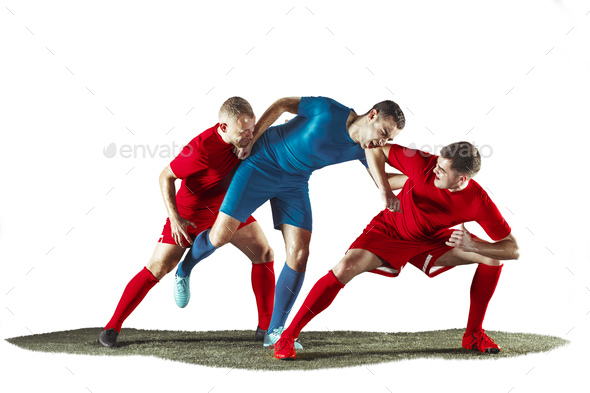 Football players tackling for the ball over white background Stock Photo by  master1305