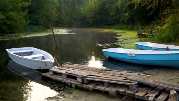 Wooden Boats Near Old Pier