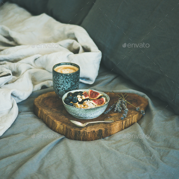 Rice coconut porridge and espresso in bed, square crop - Stock Photo - Images